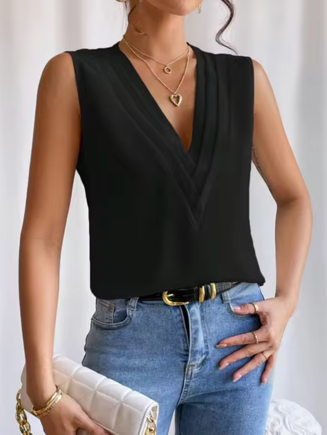 Sleeveless Women's Blouse With V Neck And Elegant Pleats